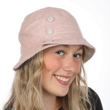 Bucket hat with pink linen effect buttons